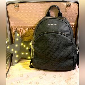 Michael Kors leather backpack with belt buckle straps